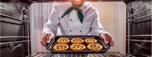 45105392-chef-prepares-pastries-in-the-oven-view-from-the-inside-of-the-oven-cooking-in-the-oven–Stock-Photo